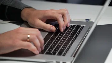 Man types on the laptop Stock Footage 85951358