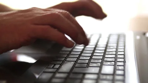 A man types on a laptop keyboard. Stock Footage 72775151