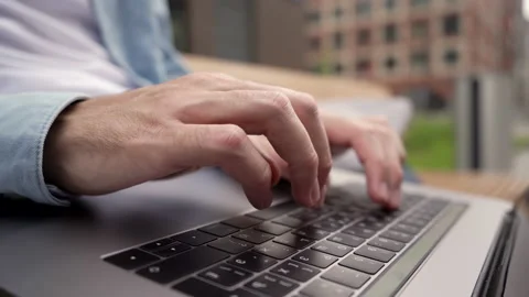 A man types on a laptop keyboard a message and surfs the space of the Internet.  스톡 동영상 134211393