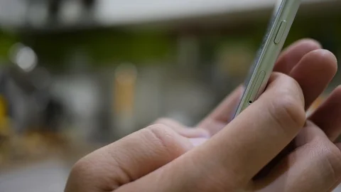 Man types a message and chooses smiley using messanger on a smartphone 스톡 동영상 86156064