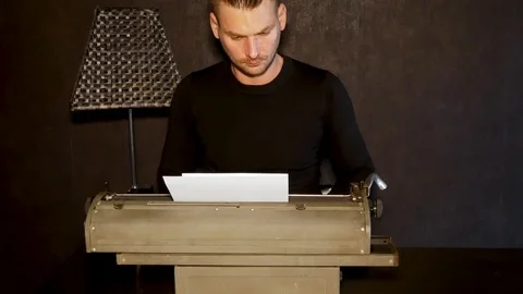 Man types on an old typewriter. Stock Footage 102537600