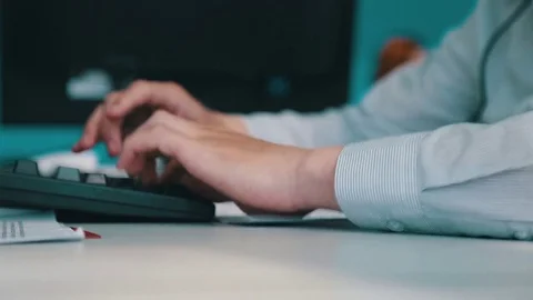 The man types the text Stock Footage 75950439