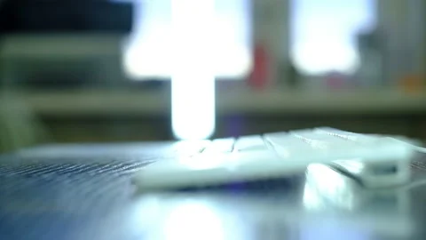 A man types text on a white keyboard. 스톡 동영상 130377844