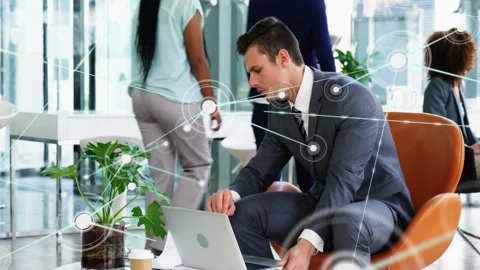 Man typing to analyze business data on laptop in lounge, activating HUD graphics Stock Footage 333962172