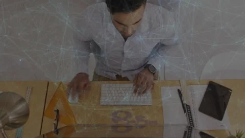Man typing and clicking mouse at desk, keypress initiating web overlay mapping Stock Footage 331045540