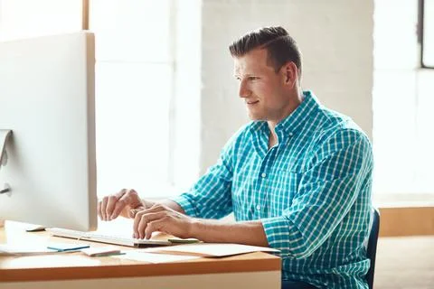 Man, typing and happy with computer at startup for review, project manageme.. Stock Photos