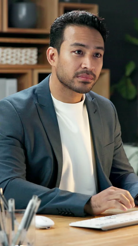 Man, typing and internet in office with computer, human resources report and ERP Stock Footage 344285375