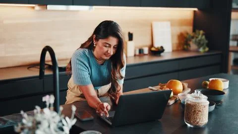 Man, typing and meal prep in kitchen with laptop, food blog or search onlin.. Stock Photos
