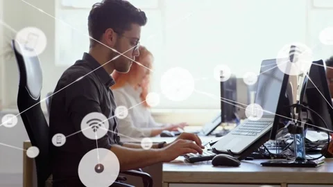 Man typing and moving mouse at desk, starting tech network icon overlay covering Stock Footage 332428432