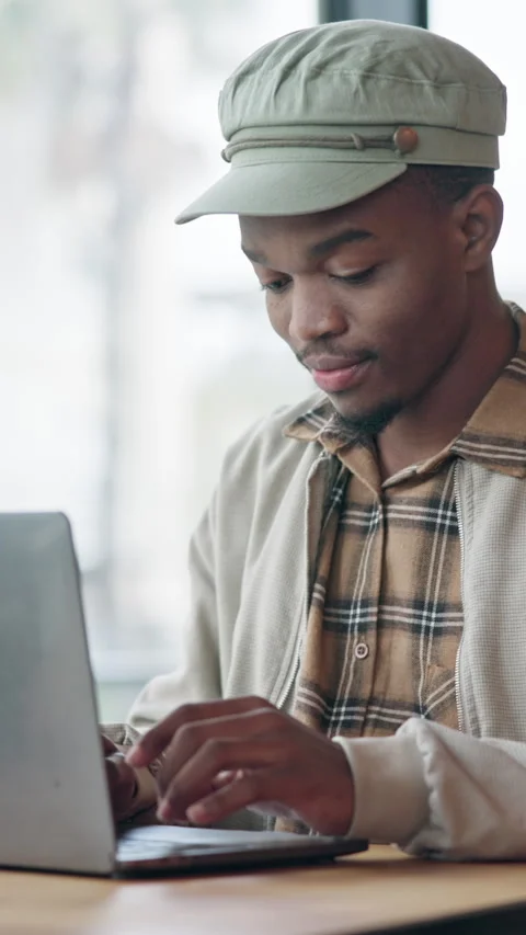 Man, typing and remote work in restaurant with laptop, creative project and Stock Footage 336717445