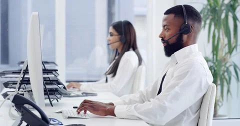 Man, typing and telecom in call center with computer, client support and tr.. Stock Photos