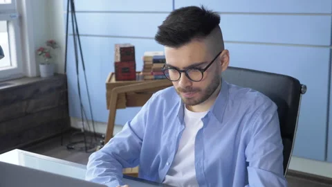 Man Typing And Working On Laptop in cozy home office Stock Footage 147844150