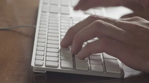 Man typing on apple keyboard. Stock Footage 39968530