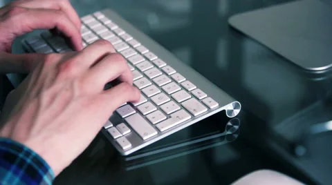 Man is typing in a apple keyboard. Stock Footage 39992761