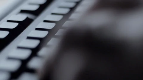 Man typing on black computer keyboard Stock Footage 33870481