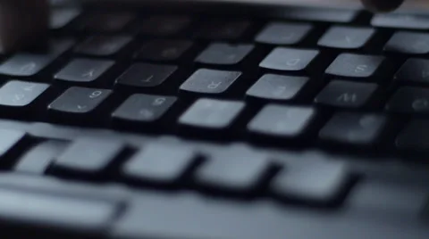 Man typing on black computer keyboard, tracking Stock-Footage 33897889