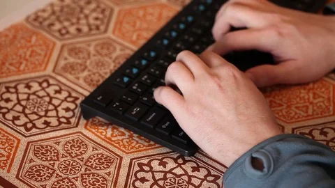 Man typing on a black keyboard. Hands close-up Stock Footage 72560347