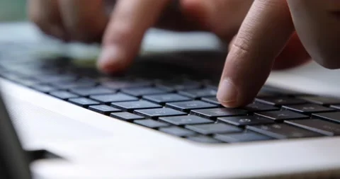 Man typing on a black keyboard macro close up Stock Footage 133917959