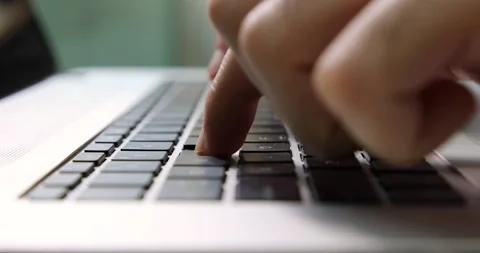 Man typing on a black keyboard macro close up Stock Footage 133918024