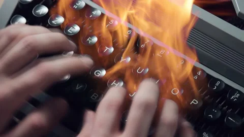 A man typing on a burning typewriter 库存影片 175722181
