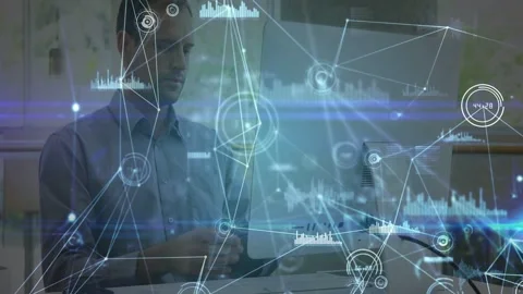 Man typing, causing network nodes over screen obscuring him, pausing to call Stock Footage 332731706