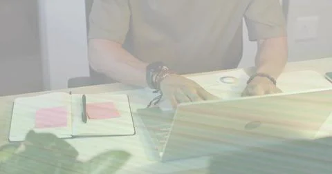 Man typing, checking pie chart, then sliding sheet, picking pen, marking pink Stock Photos