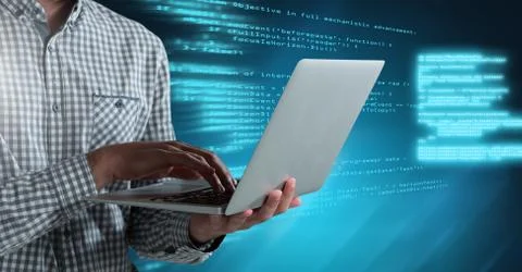 Man typing coding text on laptop Stock Photos