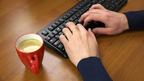 Man typing on a computer Stock Footage 100111768