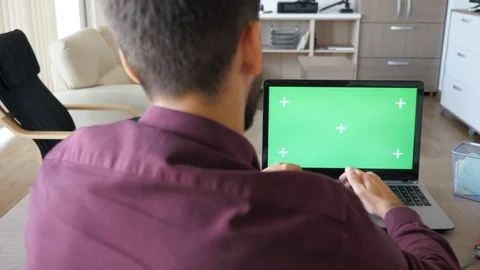 Man typing on computer with green screen chroma mock up Stock Footage 95671569