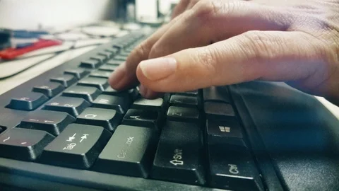 Man Typing On Computer Keyboard with both hands Vídeo Stock 86422834
