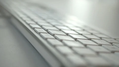 Man typing on a computer keyboard, close up with shallow depth of field Stock Footage 94265820