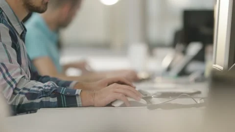 Man Typing on Computer Keyboard at Desk, Bright Open Office, Medium Shot Stock Footage 341573846