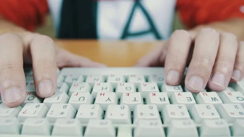 A man typing on a computer keyboard. Stock Footage 70170450