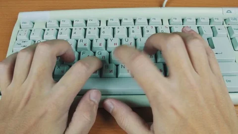 A man typing on a computer keyboard Stock Footage 70170561