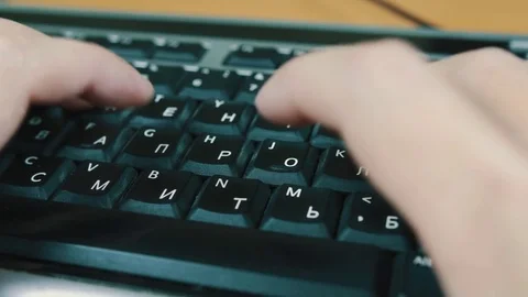 A man typing on a computer keyboard Stock Footage 70568734