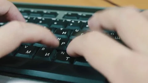 A man typing on a computer keyboard Stock Footage 70568995