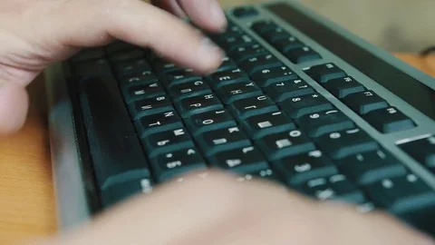 A man typing on a computer keyboard Stock Footage 70569481