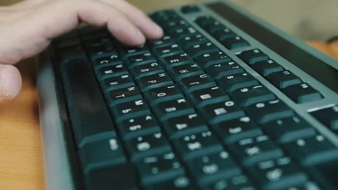 A man typing on a computer keyboard Stock Footage 70569592