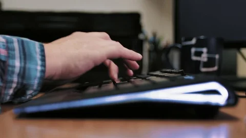 Man typing on computer keyboard Stock Footage 85401782