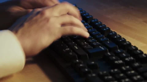 A man typing on computer keyboard Stock Footage 224893348
