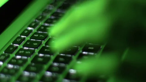 Man typing on computer keyboard at night Stock Footage 71989170