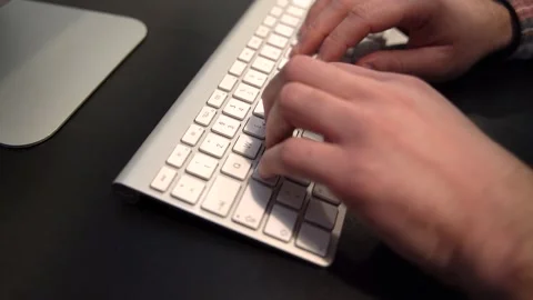Man typing on the computer keyboard in the office Stock Footage 159468441