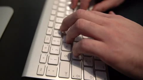 Man typing on the computer keyboard in the officer Stock Footage 159468402