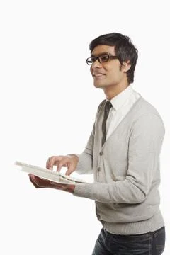 Man typing on a computer keyboard Stock Photos