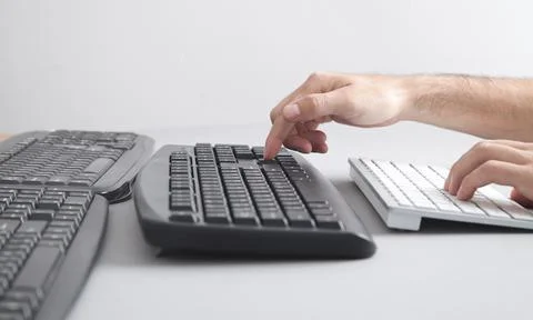 Man typing on computer keyboard. Stock Photos