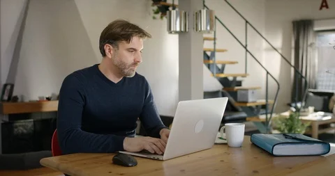 Man typing on Computer then sitting back and relaxing Video stock 86553846
