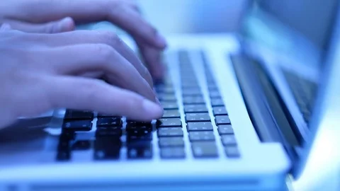 A man Typing on the computers keyboard Stock Footage 75847216