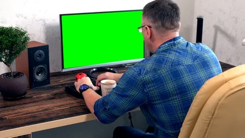 Man typing data on his desktop computer Stock Footage 109179351