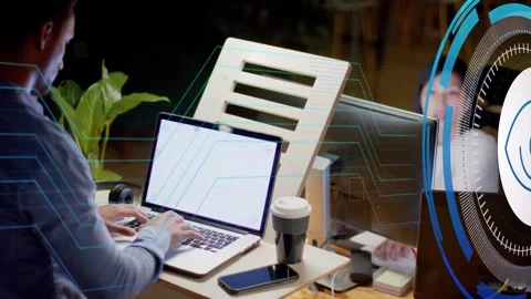 Man typing at desk initiating eye icon and circuit lines visualizing data in Video stock 334729032