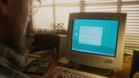 Man Typing Email on Retro Computer with Flickering CRT Monitor at Home Stock Footage 327232855